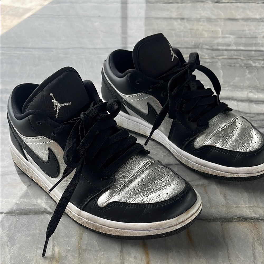 Nike air Jordan women’s Black and Metallic Silver Sneakers
